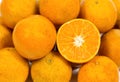 Closeup of sliced Ã¢â¬â¹Ã¢â¬â¹oranges in the market.Top view of freshly harvested fruit of an orange tree with organic orange green Royalty Free Stock Photo